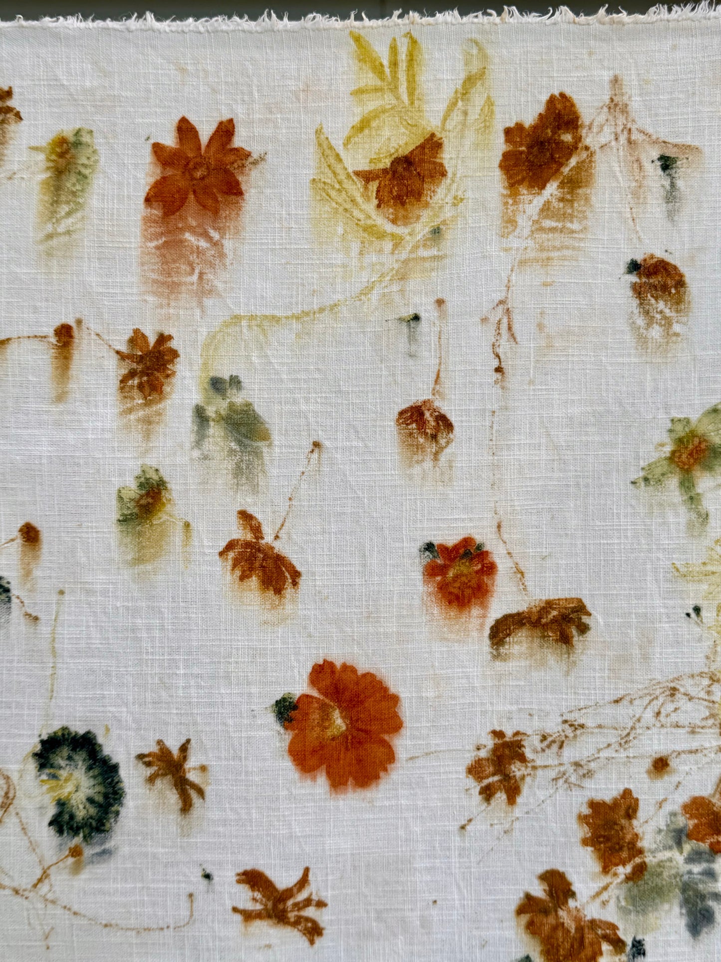 eco-printed linen fabric - close-up of the flowers printed 