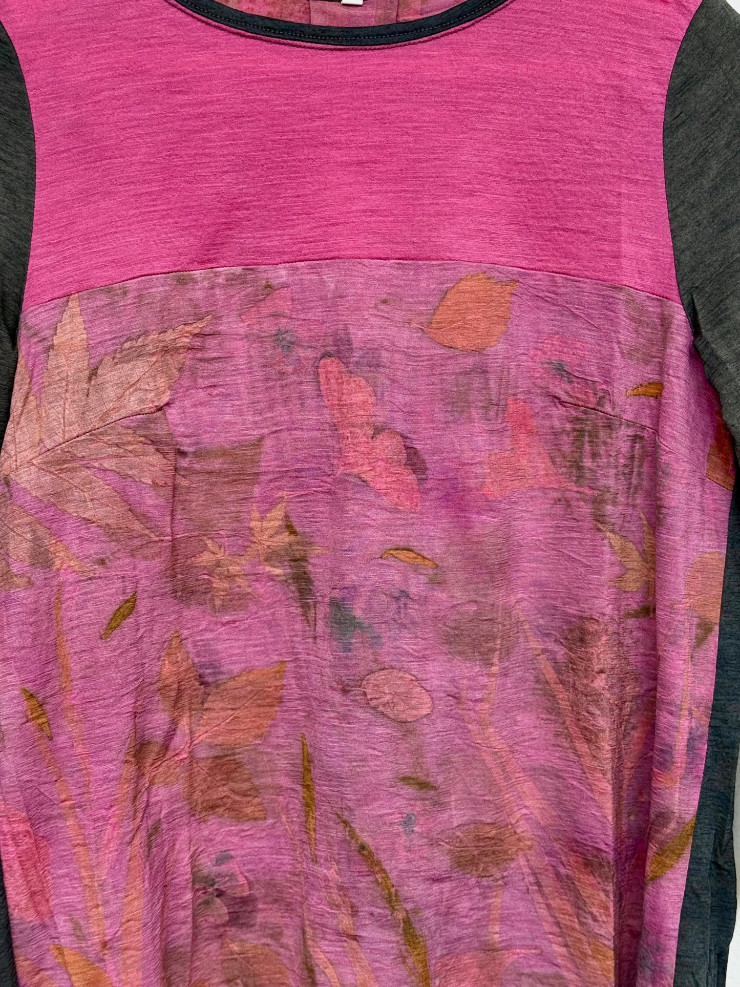 close-up of the eco-printed front part of a naturally pink dyed merino top