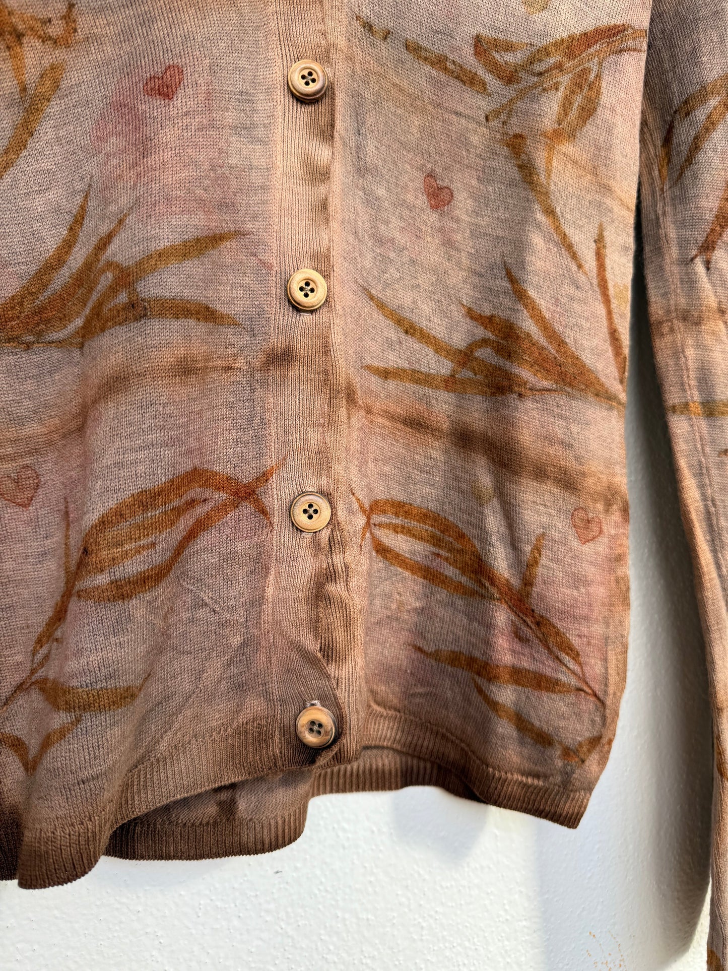 floral eco-print pattern on an upcycled, naturally dyed woolen sweater