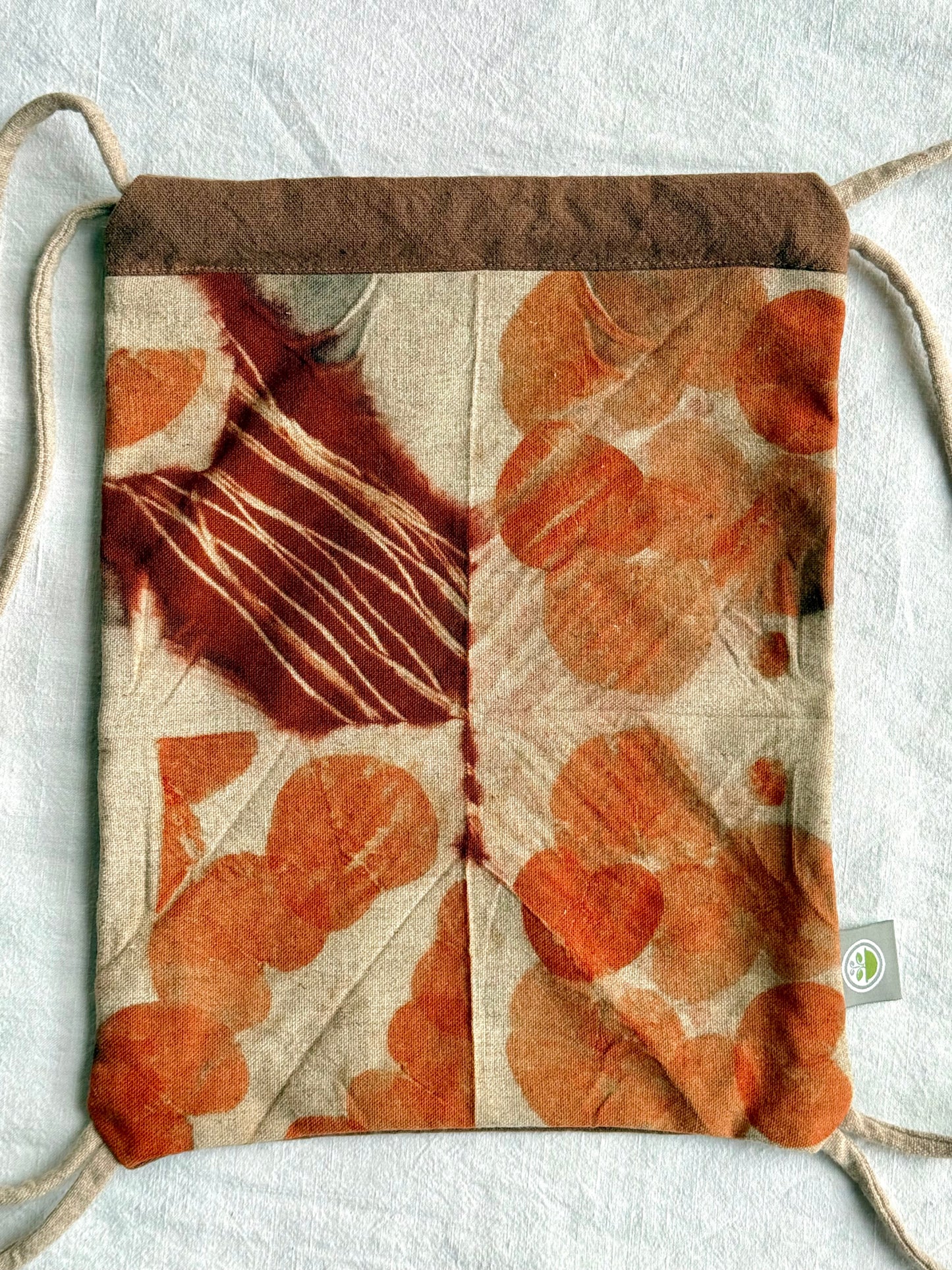 front of a naturally dyed and eco-printed eucalyptus woolen bag by DOT 'N' POT