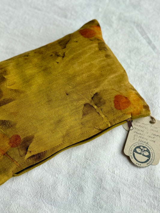 Herbal pillow with floral pattern and a tag on a white background from DOT'N' POT