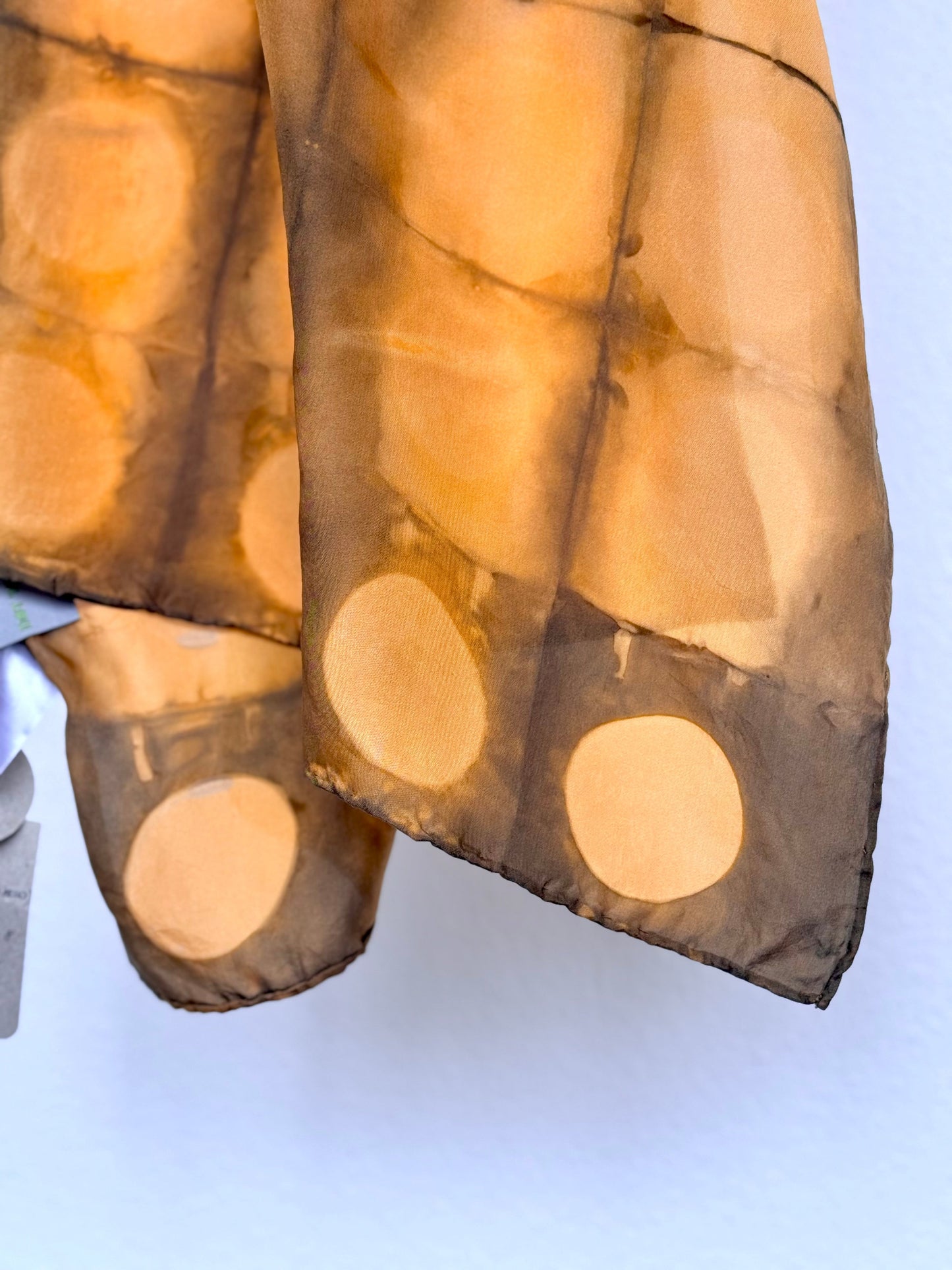 Annatto dyed shibori silk scarf with circle pattern