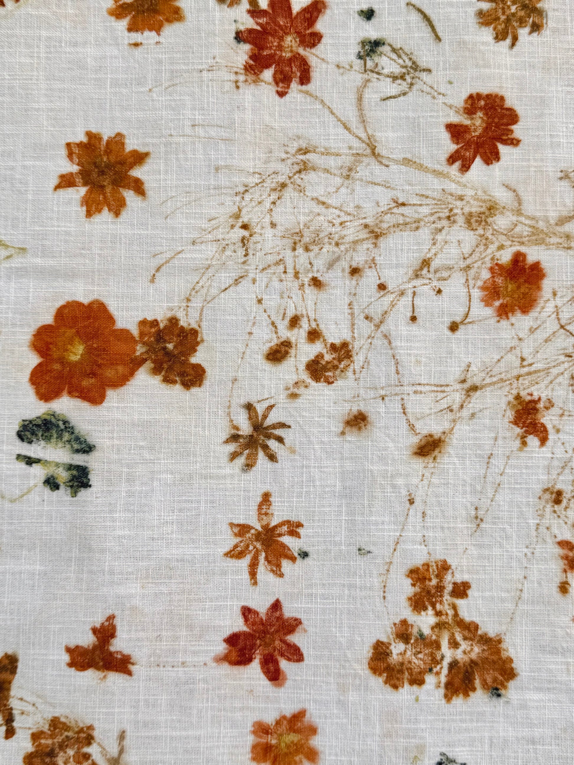 eco-printed linen fabric - close-up of a coreopsis stem flower print