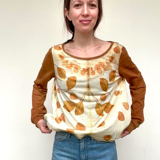 woman wearing a merino wool top that was naturally dyed and eco-printed with eucalyptus by DOT 'N' POT