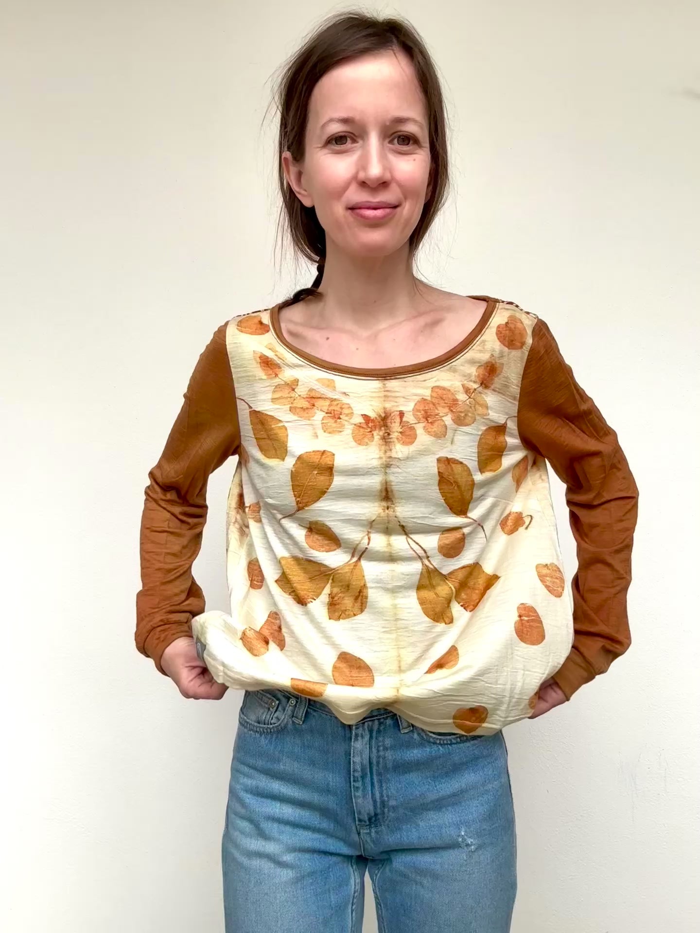 woman wearing a merino wool top that was naturally dyed and eco-printed with eucalyptus by DOT 'N' POT