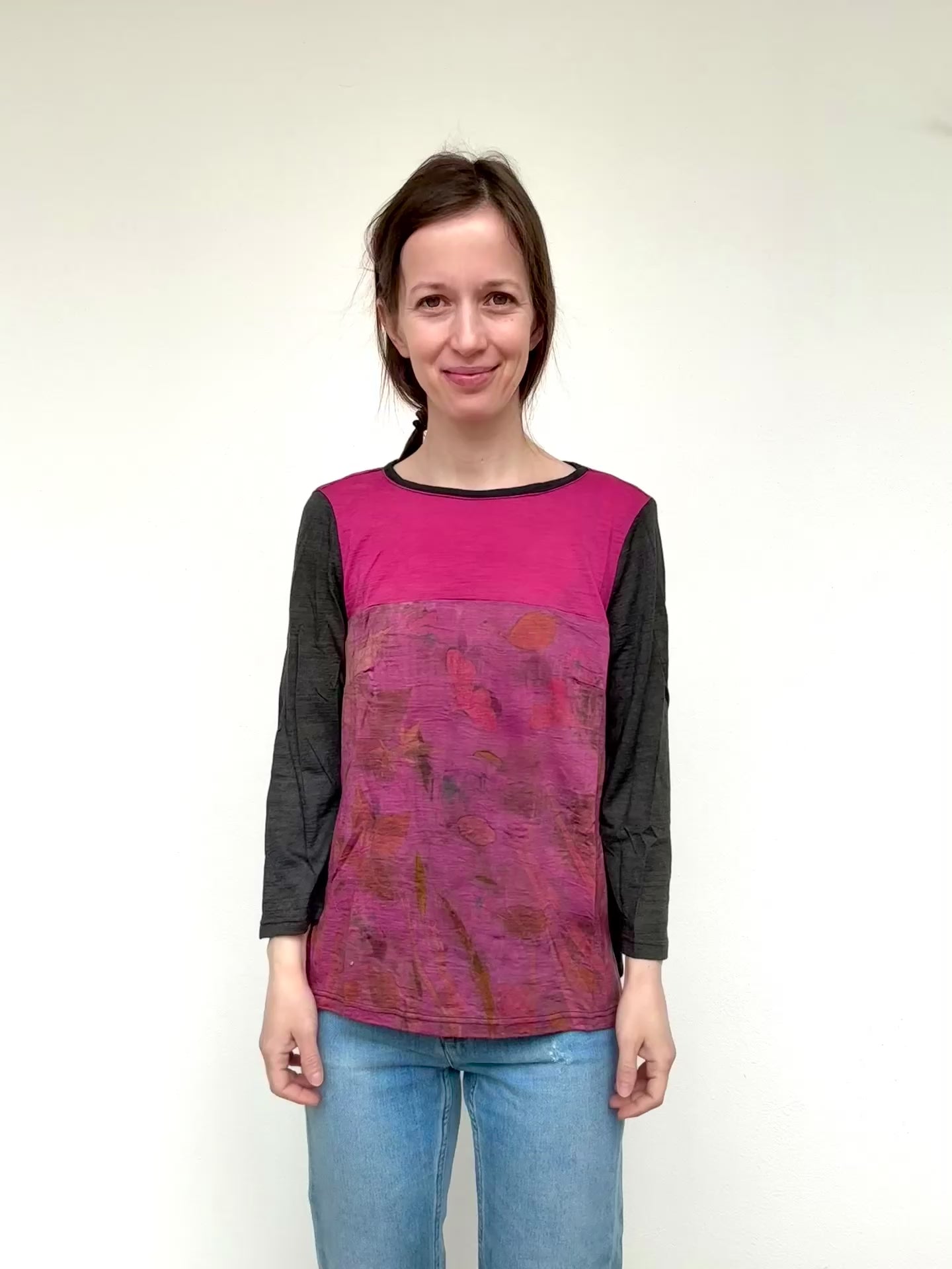 woman wearing a merino wool top dyed with cochineal and logwood, eco-printed with plants by DOT 'N' POT